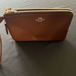 Coach double zip wallet in color redwood with gold metal. New, never used.